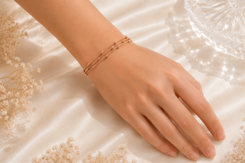 Celestial Harmony: Triple-Strand Rose Gold Beaded Bracelet
