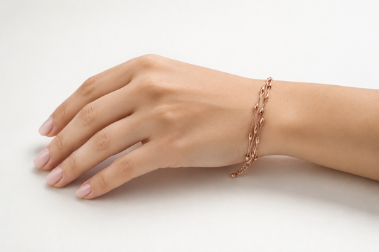 Serene Whispers: Triple-Strand Rose Gold Bead Bracelet